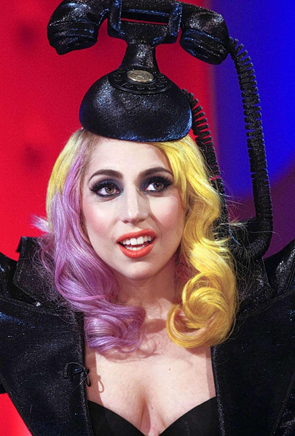16P Lady Gaga in ripped fishnets stockings on stage and with long hair