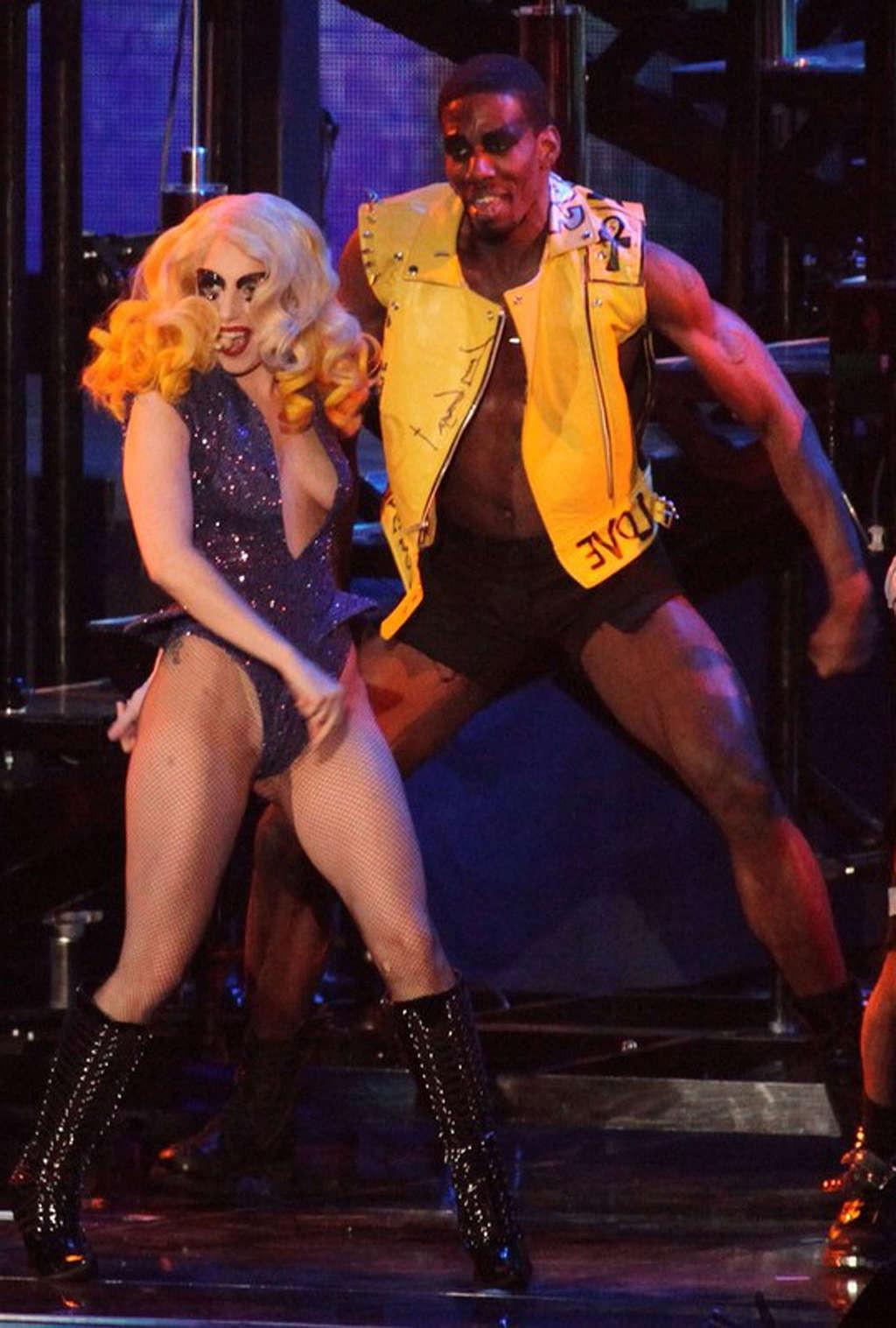 10P Lady Gaga showing her ass in onepiece outfit on stage and topless