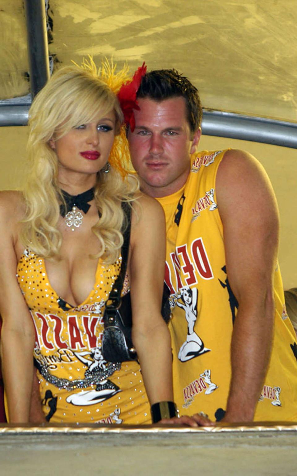 16P Paris Hilton show big cleavage in yellow mini skirt and her nice tits