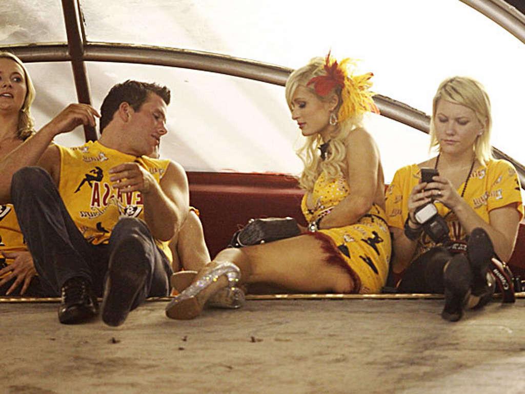 16P Paris Hilton show big cleavage in yellow mini skirt and her nice tits