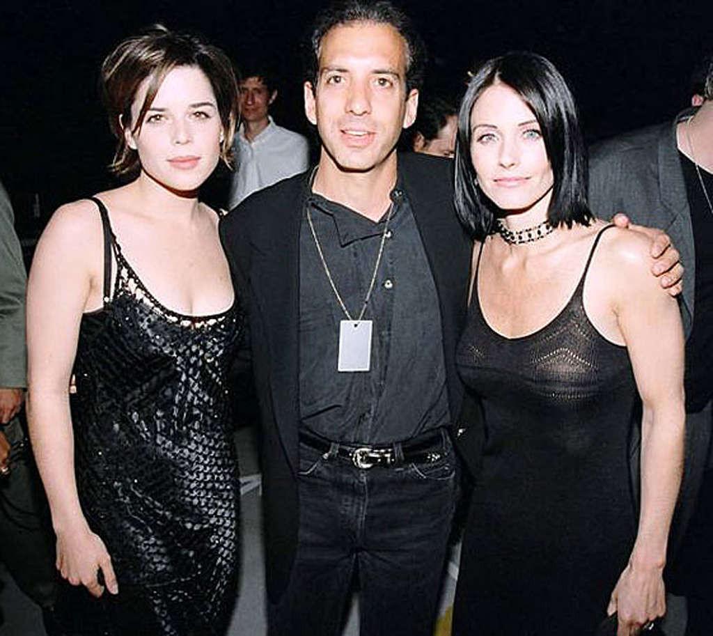 16P Courteney Cox very leggy in mini skirt and tits slip in water