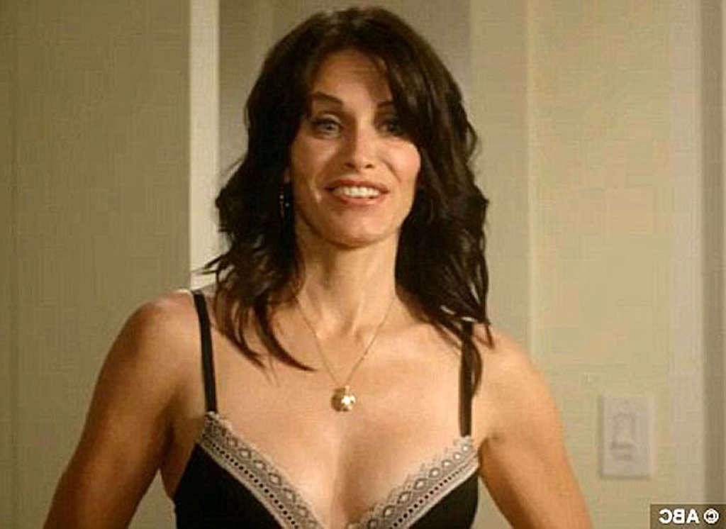 16P Courteney Cox very leggy in mini skirt and tits slip in water