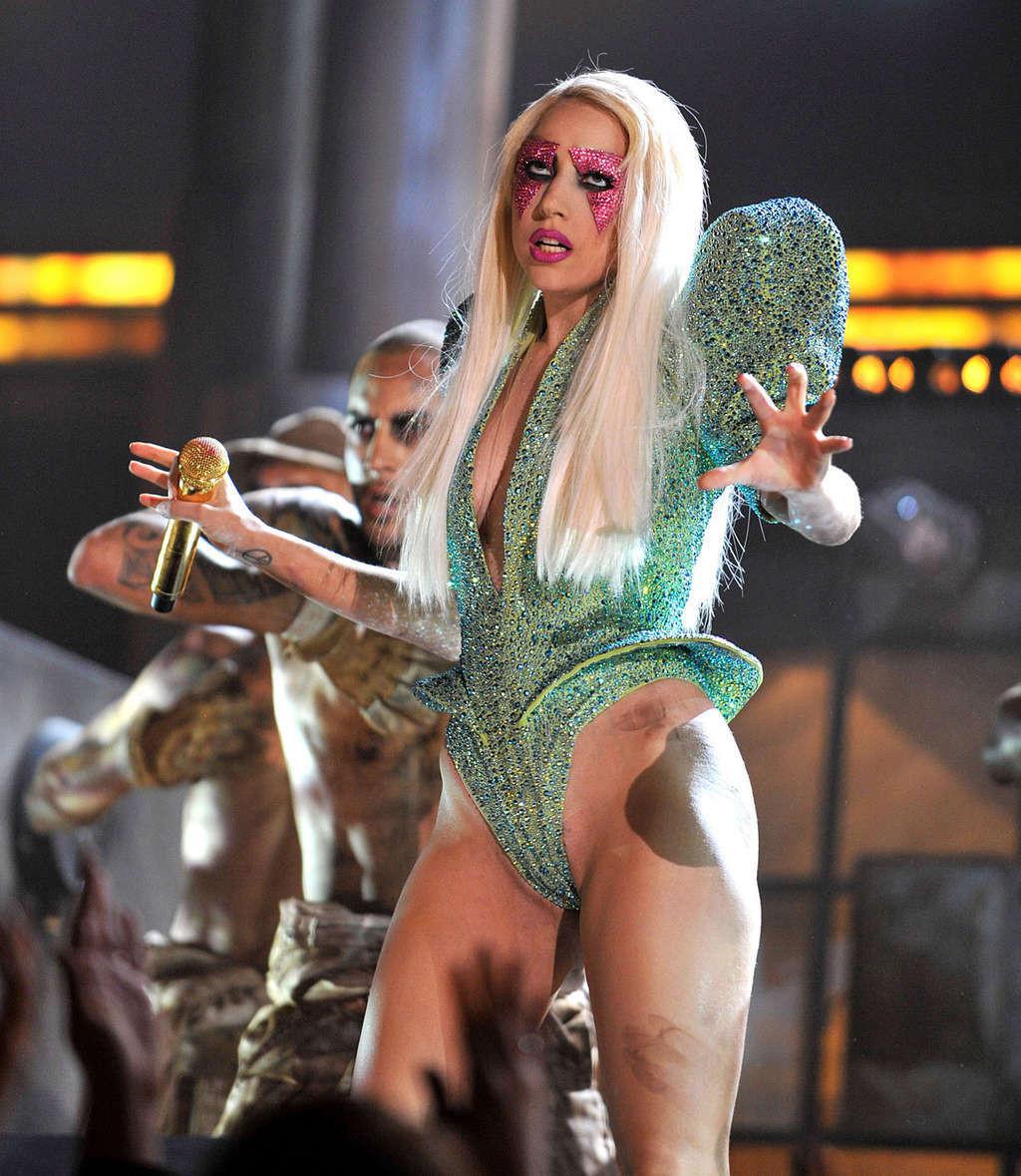 16P Lady Gaga exposing her nice ass in sexy outfit on stage
