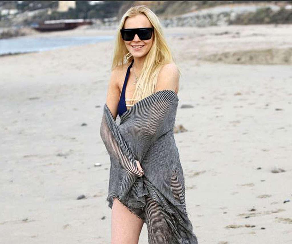 16P Lindsay Lohan in bikini and nipple slip and upskirt