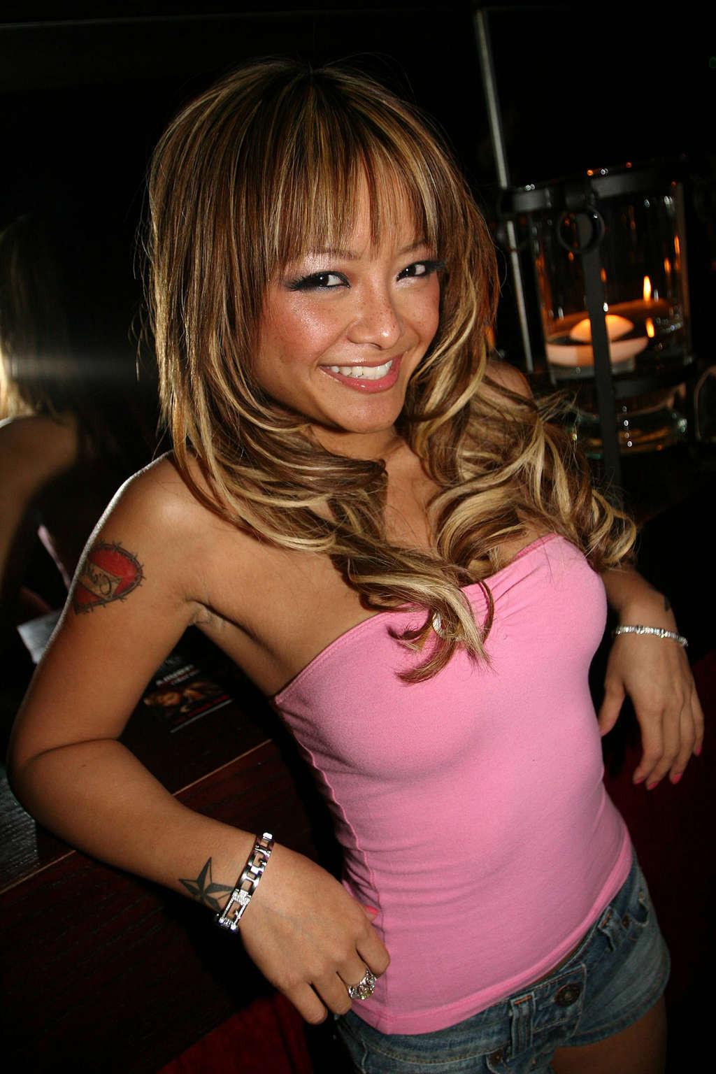 9P Tila Tequila posing sexy in mini skirt and fuckme boots and nipple slip