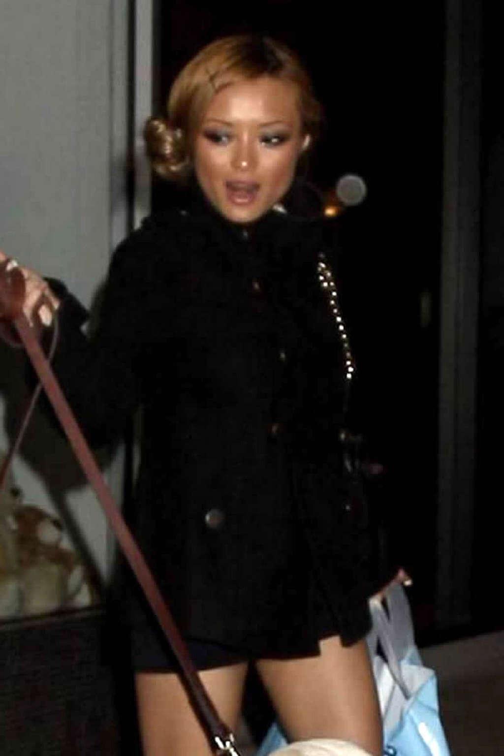 9P Tila Tequila posing sexy in mini skirt and fuckme boots and nipple slip