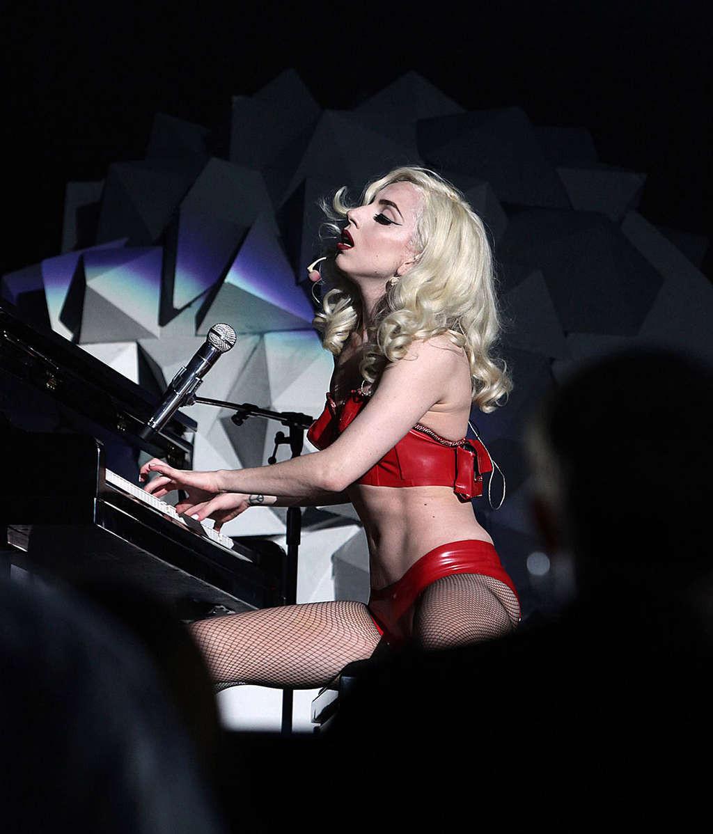 10P Lady Gaga looking very sexy in red lingerie and stockings on stage and exposing 