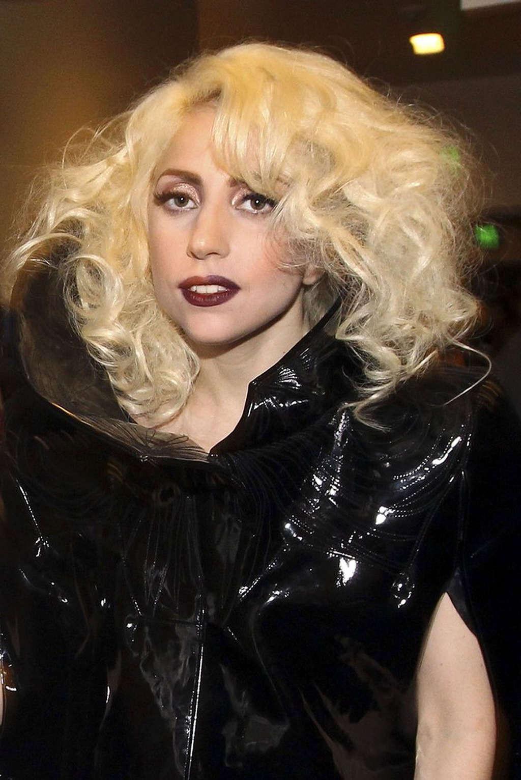 16P Lady Gaga performing in some strange outfit on concert and upskirt pictures
