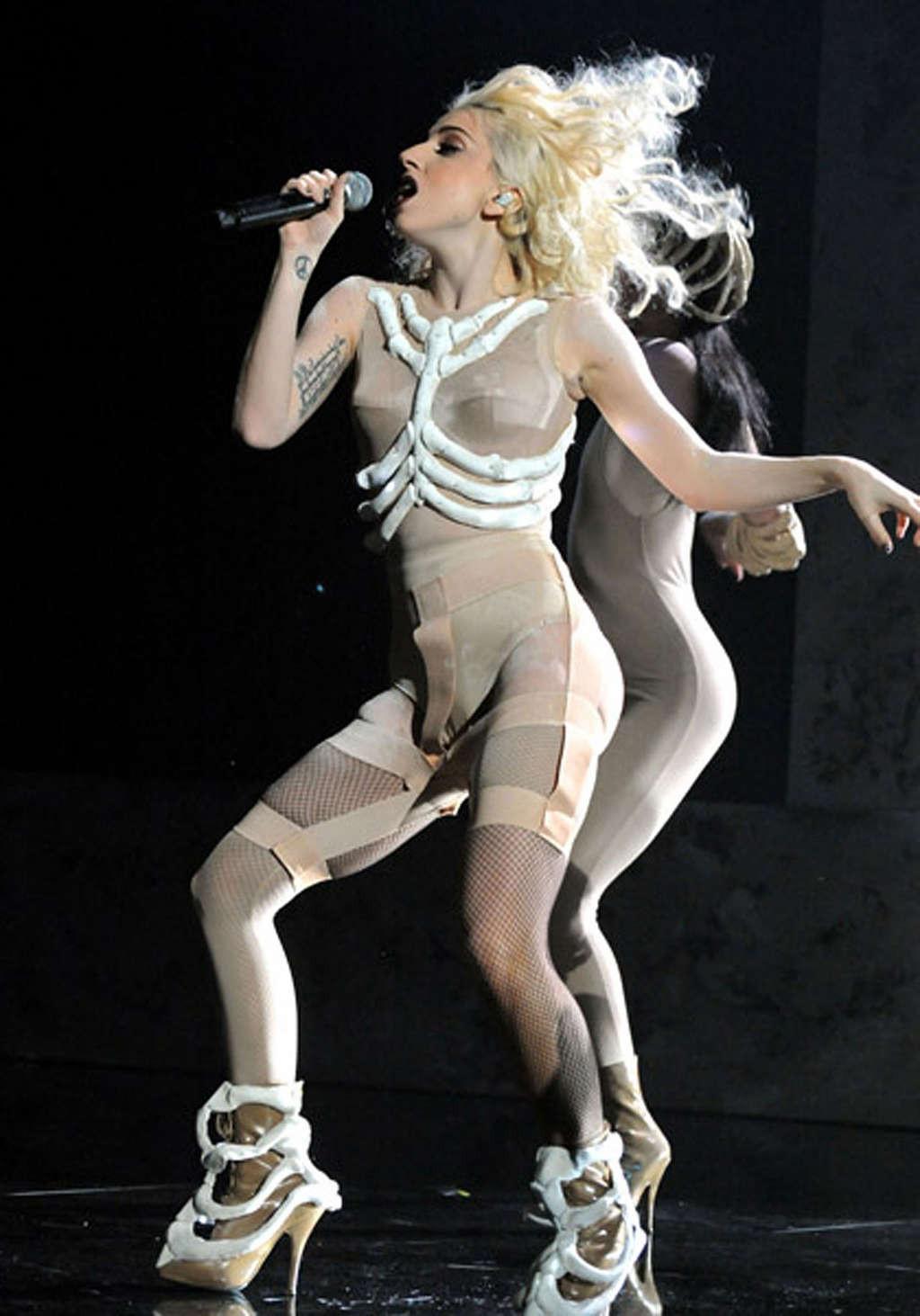 16P Lady Gaga performing in some strange outfit on concert and upskirt pictures