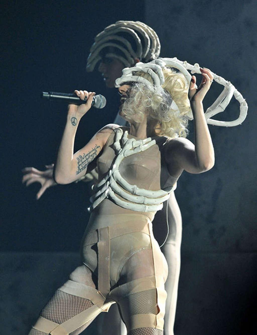 16P Lady Gaga performing in some strange outfit on concert and upskirt pictures