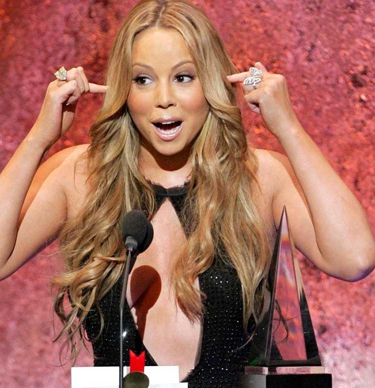 15P Mariah Carey big cleavage in open black shirt