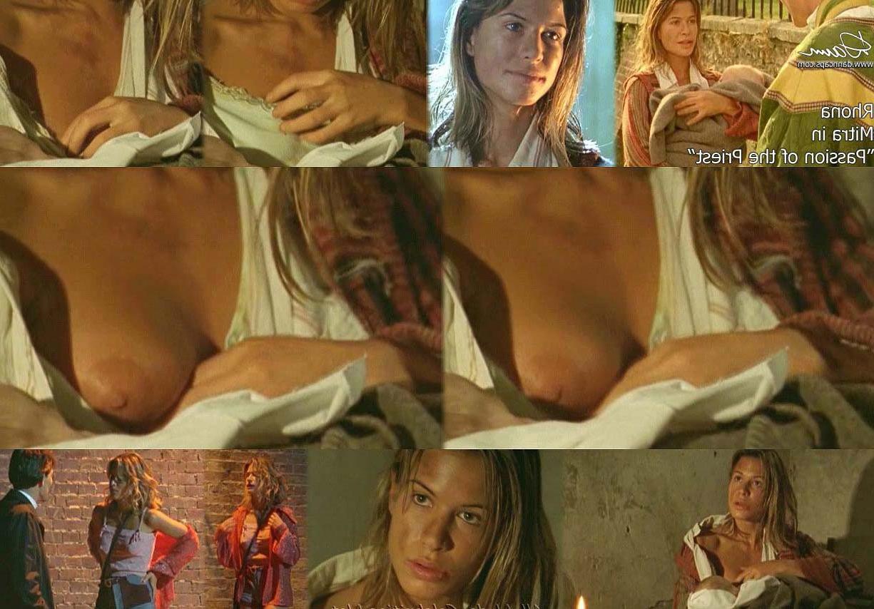 15P Rhona Mitra nude boobs nice cleavage in dress