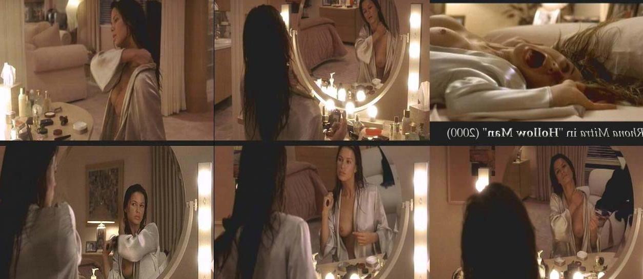 15P Rhona Mitra nude boobs nice cleavage in dress