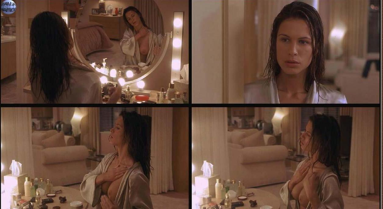 15P Rhona Mitra nude boobs nice cleavage in dress