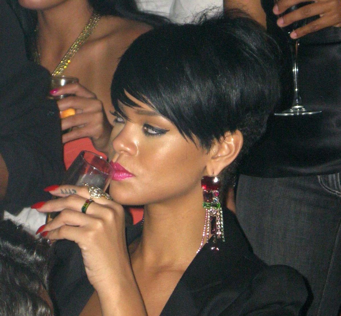15P Rihanna showing nice cleavage in sexy blue dress
