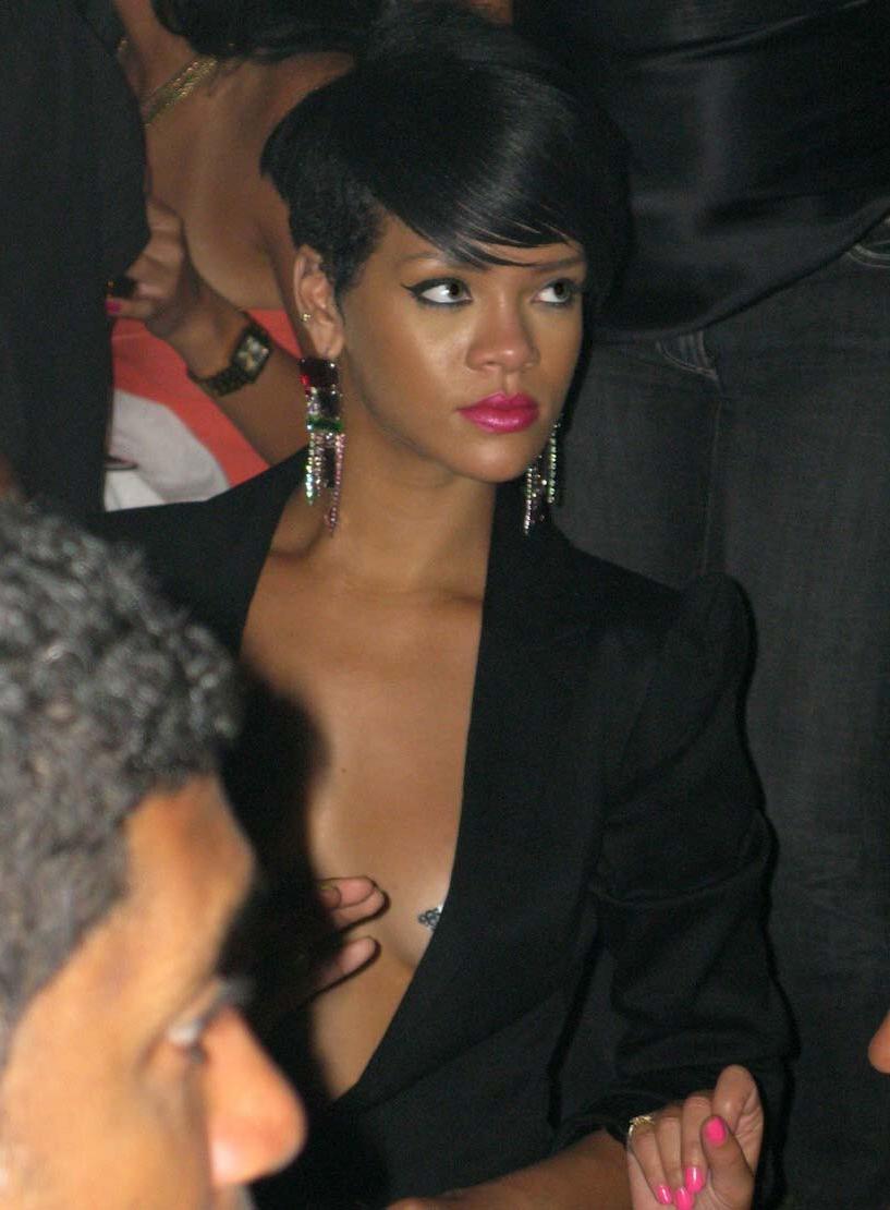 15P Rihanna showing nice cleavage in sexy blue dress