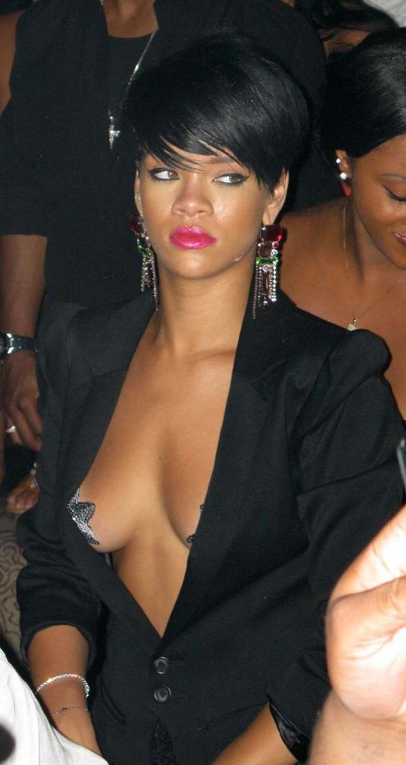 15P Rihanna showing nice cleavage in sexy blue dress