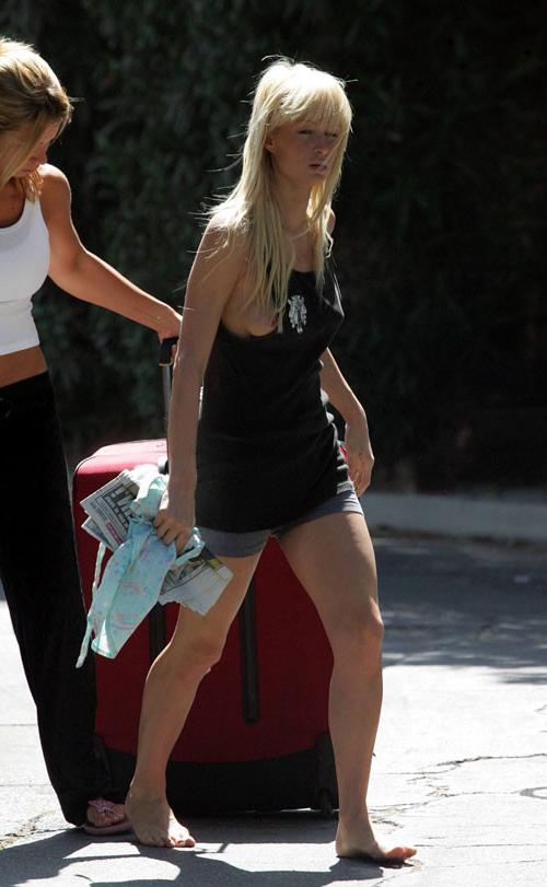 10P Paris Hilton tits slip and showing her nice pussy upskirt paparazzi pictures