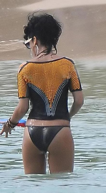 15P Rihanna wearing slutty fishnet stockings in public