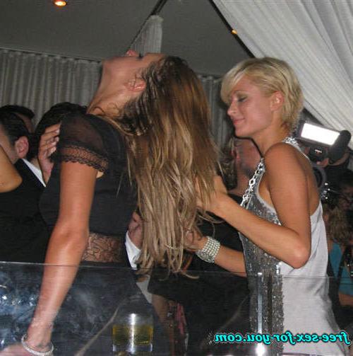 16P Paris Hilton showing great cleavage and dancing with her sister
