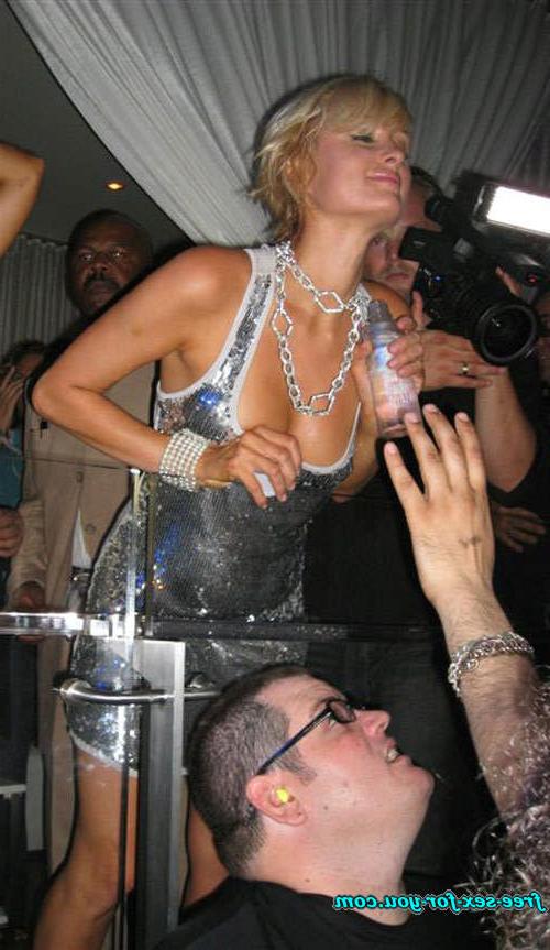 16P Paris Hilton showing great cleavage and dancing with her sister