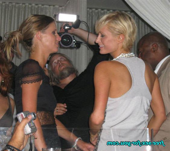 16P Paris Hilton showing great cleavage and dancing with her sister