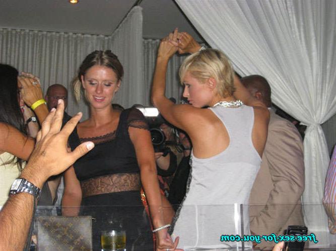 16P Paris Hilton showing great cleavage and dancing with her sister