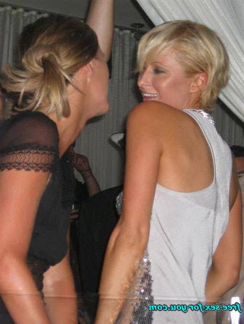 16P Paris Hilton showing great cleavage and dancing with her sister