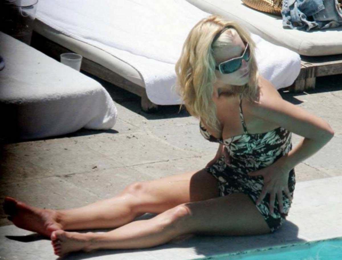 16P Jessica Simpson posing in bikini in pool and nipple slip pics