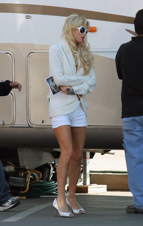 16P Paris Hilton pussy slip paparazzi pictures and sexy posing