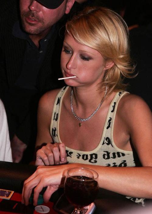 16P Paris Hilton nipple slip and posing in stockings