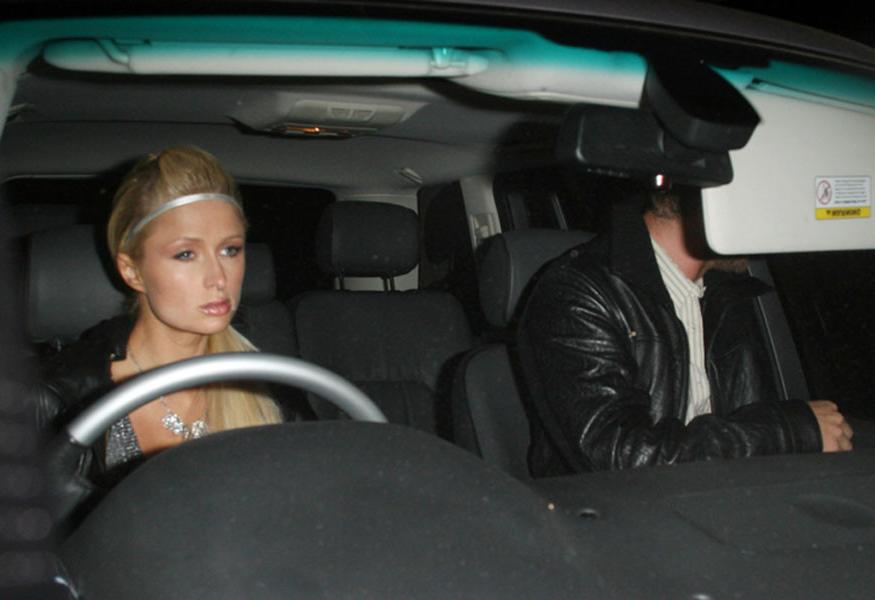 15P Paris Hilton posing nude and nipple slip paparazzi pictures