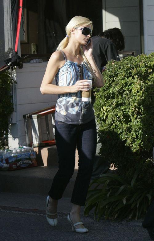 15P Paris Hilton posing nude and nipple slip paparazzi pictures