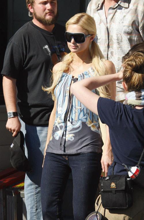 15P Paris Hilton posing nude and nipple slip paparazzi pictures