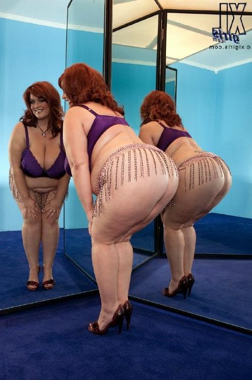 16P Horny huge girl with gigantic natural boobs posing for the camera