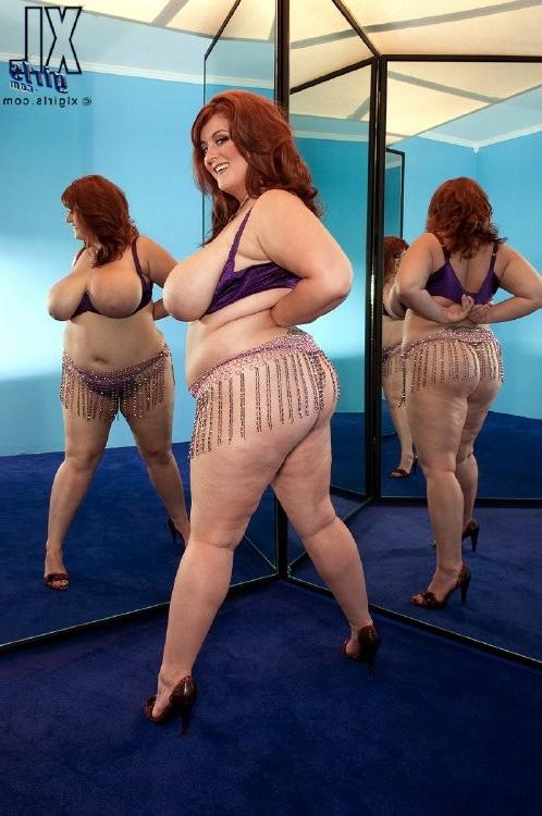 16P Horny huge girl with gigantic natural boobs posing for the camera