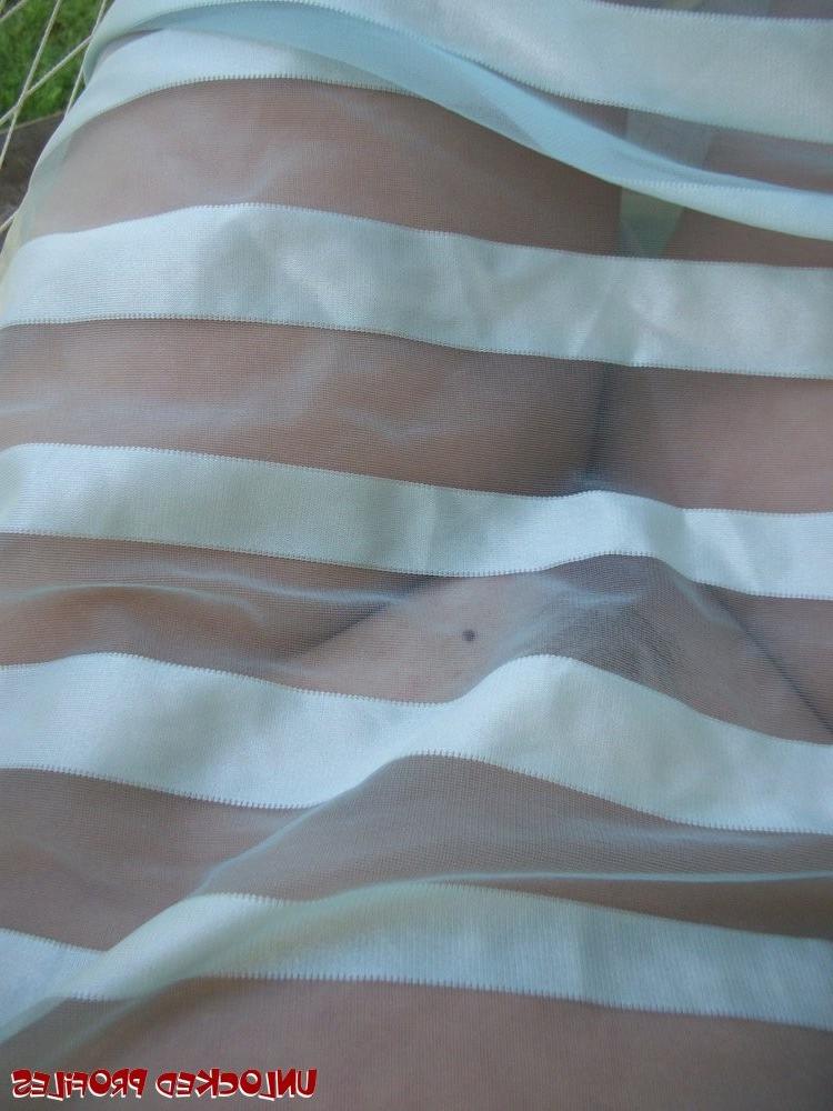 15P Olive showing off her big knockers and trimmed pussy outdoors