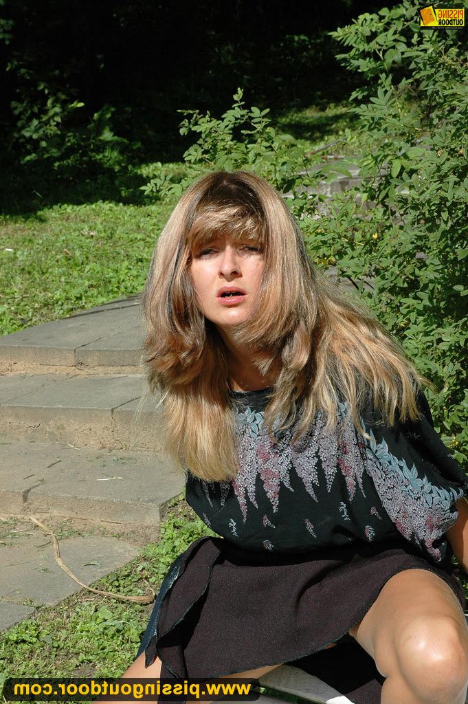 18P Pissing fetish milf pisses on the park bench