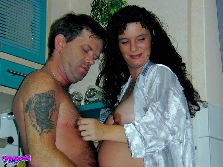16P Horny pregnant slut getting naked and sucking cock in the kitchen
