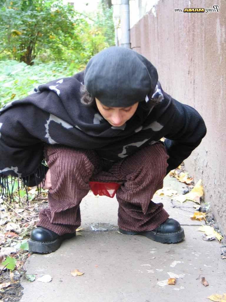 16P Slut peeing on a sidewalk