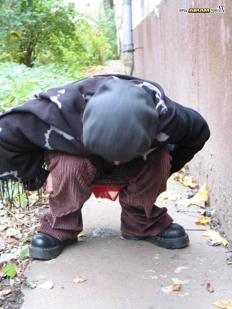 16P Slut peeing on a sidewalk