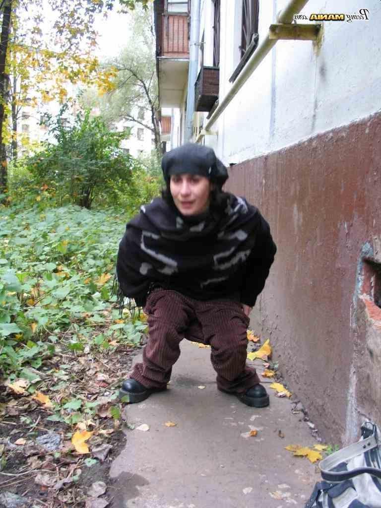 16P Slut peeing on a sidewalk