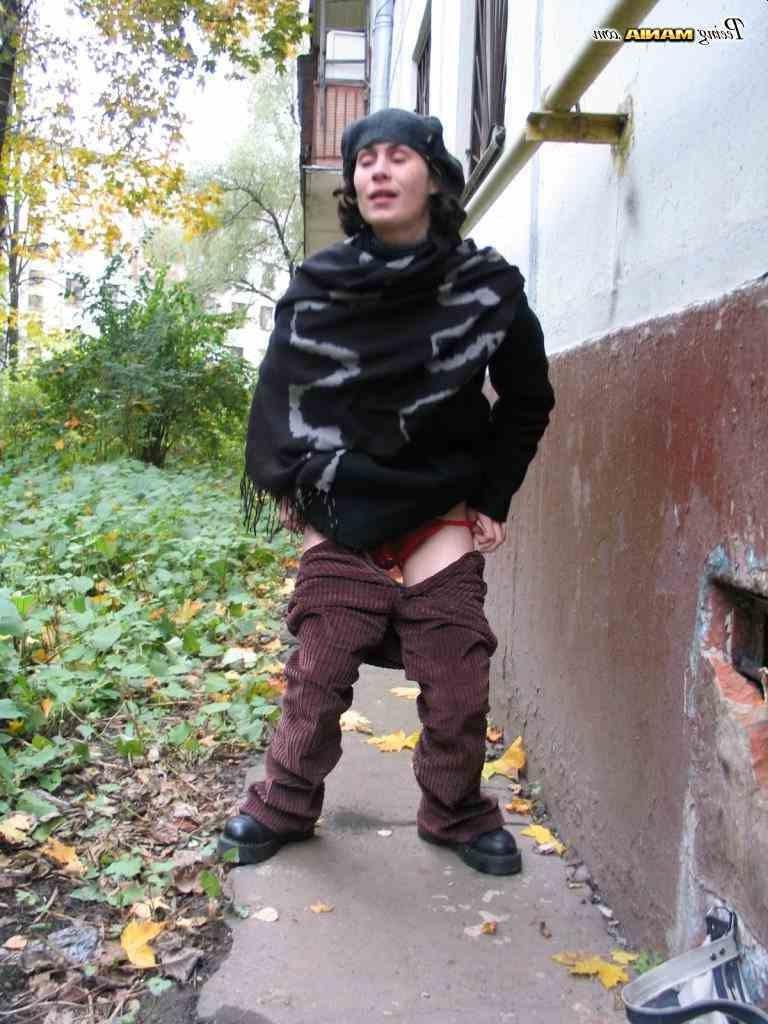 16P Slut peeing on a sidewalk