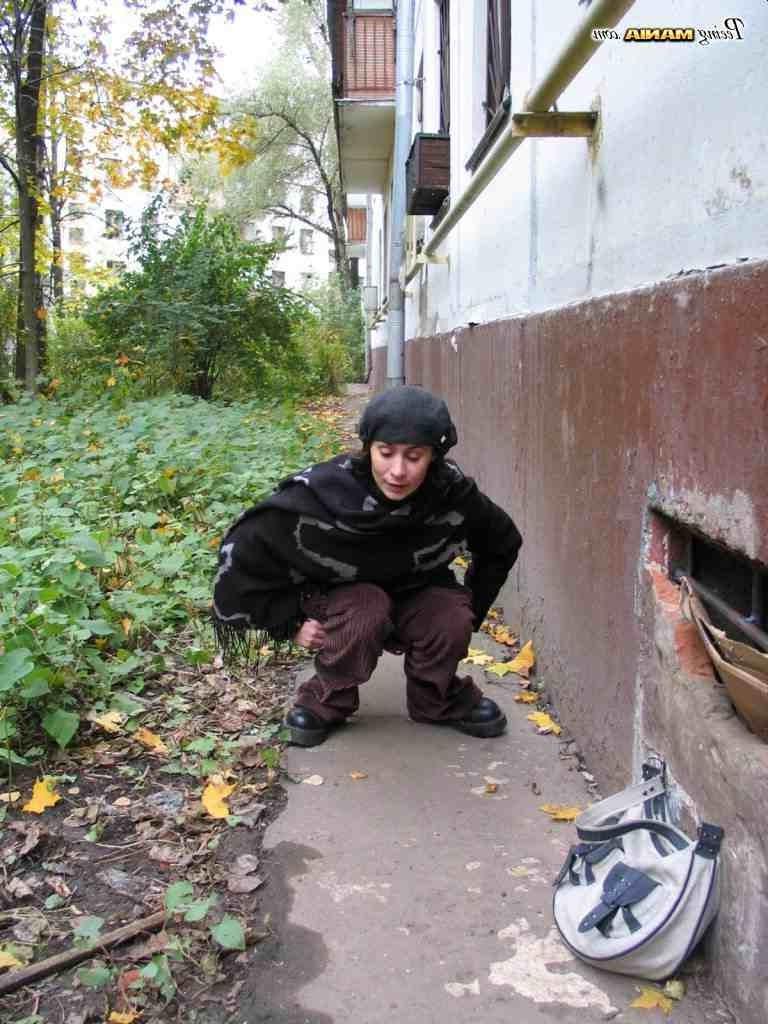 16P Slut peeing on a sidewalk