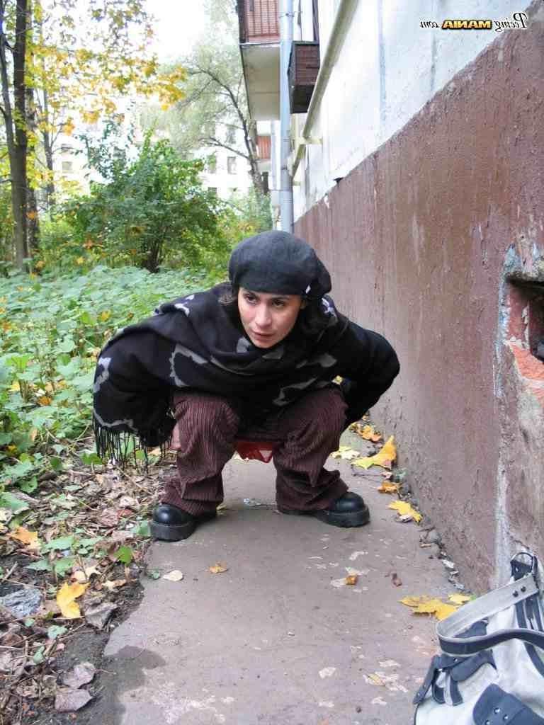16P Slut peeing on a sidewalk