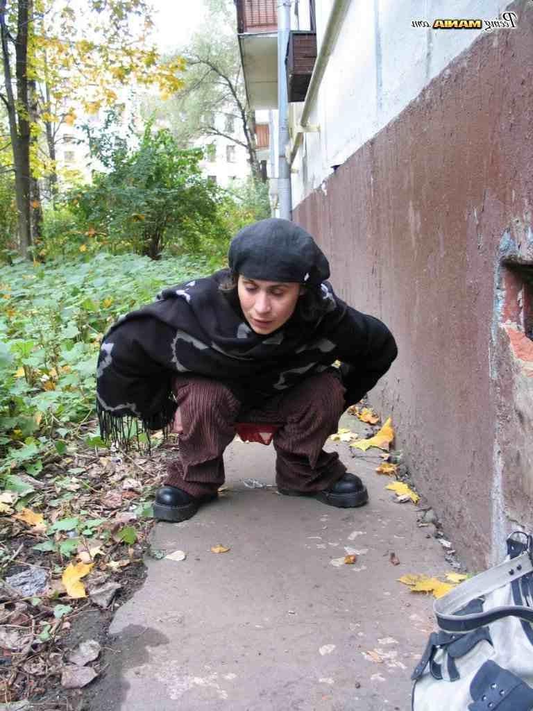 16P Slut peeing on a sidewalk