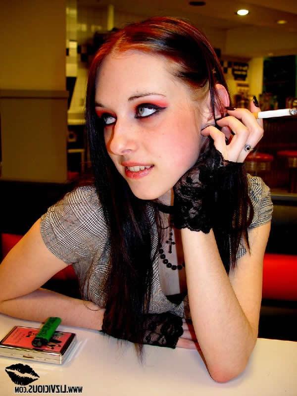 16P Smoking goth chick flashes her tits in a diner