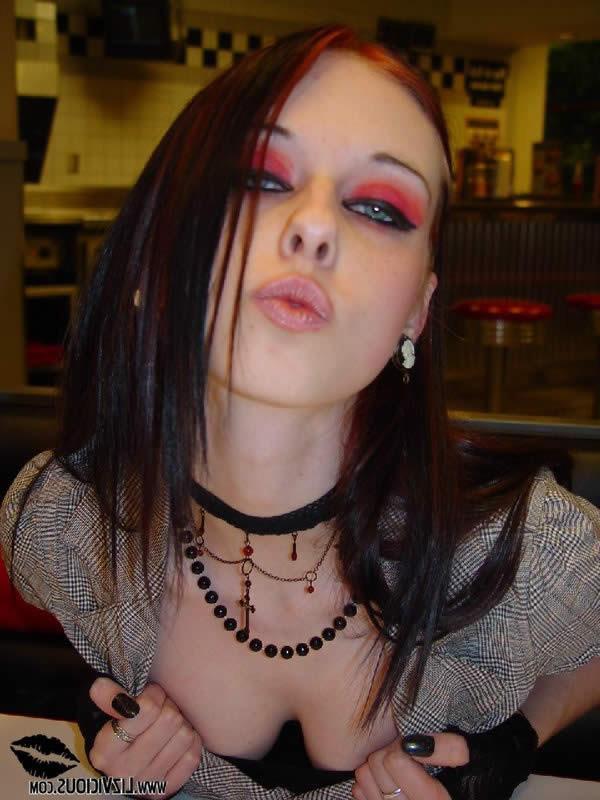 16P Smoking goth chick flashes her tits in a diner