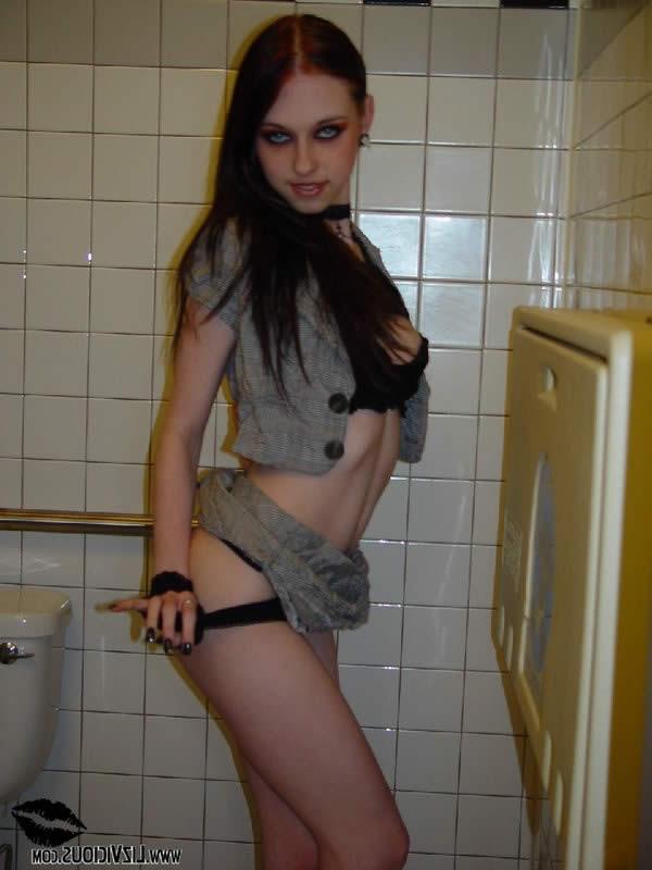 16P Smoking goth chick flashes her tits in a diner