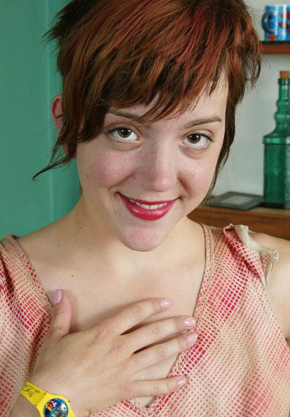 20P Amateur redhead exposing small tits